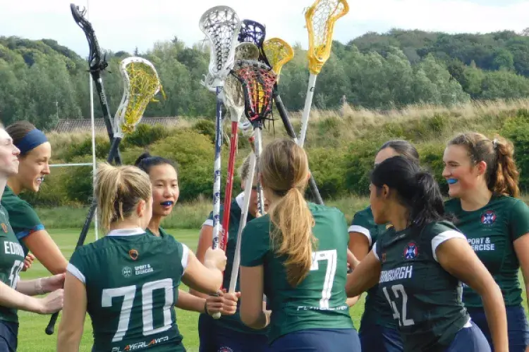 University of Edinburgh Lacrosse Club players on the pitch.